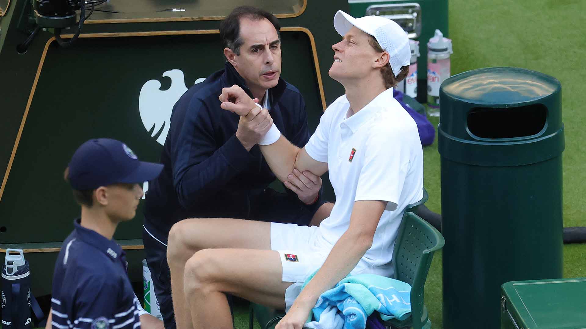 Jannik Sinner receives treatment from ATP physio Alejandro Resnicoff after his fall against Grigor Dimitrov.