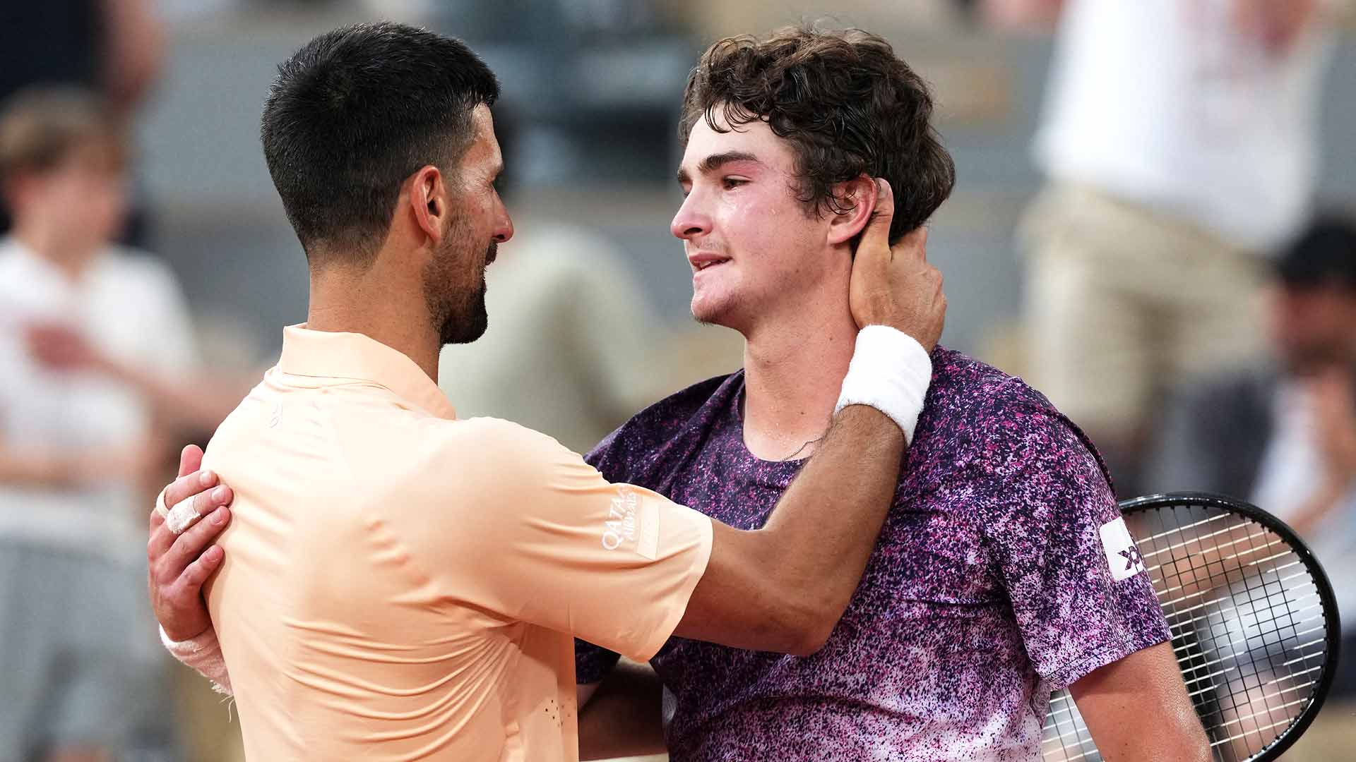 Novak Djokovic congratulates Joao Fonseca after their five-set thriller Friday evening at Roland Garros.